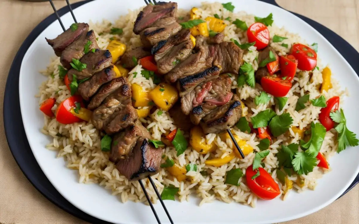 Grilled lamb kabobs with vegetable rice pilaf and tsatsiki sauce